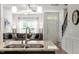 Bright, open-concept kitchen with granite countertops that flows into the living room at 7879 Allscott Way, Raleigh, NC 27612