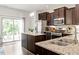 Well-equipped kitchen featuring granite countertops, stainless steel appliances, and ample cabinet space at 7879 Allscott Way, Raleigh, NC 27612