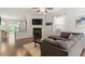 Inviting living area with a fireplace, TV, and an open layout connecting to the dining area at 7879 Allscott Way, Raleigh, NC 27612