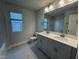 Bright bathroom featuring a double vanity and toilet at 801 Portland Rose Dr, Knightdale, NC 27545