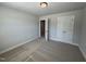 Bedroom with neutral carpet and double door closet at 801 Portland Rose Dr, Knightdale, NC 27545