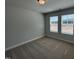 Bedroom featuring neutral carpet and two windows at 801 Portland Rose Dr, Knightdale, NC 27545
