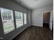 Sunlit bedroom with hardwood floors and white trim at 801 Portland Rose Dr, Knightdale, NC 27545