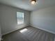 Bedroom with neutral carpet, one window and light walls at 801 Portland Rose Dr, Knightdale, NC 27545