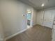 Bright bedroom, with doorway access to bathroom, and closet with white doors at 801 Portland Rose Dr, Knightdale, NC 27545