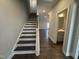 Welcoming entryway featuring hardwood floors and a staircase at 801 Portland Rose Dr, Knightdale, NC 27545