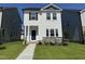 Charming two-story home with a well-maintained lawn and stone accents at 801 Portland Rose Dr, Knightdale, NC 27545