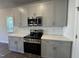 Beautiful kitchen with stainless steel appliances and gray cabinets at 801 Portland Rose Dr, Knightdale, NC 27545