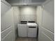 Convenient laundry room with modern washer and dryer hookups with wire shelving above at 801 Portland Rose Dr, Knightdale, NC 27545