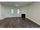 Inviting living room with fireplace, hardwood floors, and bright windows at 801 Portland Rose Dr, Knightdale, NC 27545