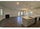 Open-concept living room with fireplace and hardwood floors at 801 Portland Rose Dr, Knightdale, NC 27545