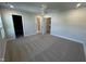 Spacious main bedroom featuring carpet flooring and connected bathroom and walk-in closet at 801 Portland Rose Dr, Knightdale, NC 27545