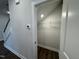 Under stairs closet offering practical storage with a light and wire shelving at 801 Portland Rose Dr, Knightdale, NC 27545