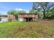 Brick home featuring a backyard with a deck and patio space, perfect for outdoor entertaining at 807 New St, Graham, NC 27253
