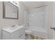 Clean bathroom featuring a white vanity, mirror, toilet, and tub/shower combination at 807 New St, Graham, NC 27253