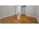 Hardwood bedroom with view into bathroom and large closet at 807 New St, Graham, NC 27253