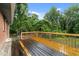 Wooden deck overlooking private backyard oasis, perfect for outdoor entertaining and relaxation at 807 New St, Graham, NC 27253
