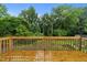 Spacious wooden deck showcasing backyard views, perfect for outdoor gatherings and scenic relaxation at 807 New St, Graham, NC 27253