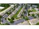 Community aerial view with townhomes, parking, manicured lawns, and tree-lined streets at 818 Bryant St, Raleigh, NC 27603