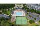 Stunning aerial shot of the community pool, tennis courts, and gazebo roundabout at 818 Bryant St, Raleigh, NC 27603