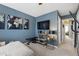 Bedroom with a chaise lounge and a wall-mounted television for entertainment and relaxation at 818 Bryant St, Raleigh, NC 27603