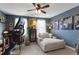 Bedroom featuring a ceiling fan, ample natural light, and a comfortable chaise lounge at 818 Bryant St, Raleigh, NC 27603