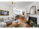 Charming dining area with modern lighting, hardwood floors, and view to the kitchen at 818 Bryant St, Raleigh, NC 27603