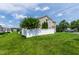A charming home showcases its landscaped yard and white picket fence in a serene neighborhood setting at 818 Bryant St, Raleigh, NC 27603