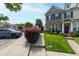 Well-maintained townhouse with manicured lawn, tasteful landscaping, and convenient sidewalk access at 818 Bryant St, Raleigh, NC 27603