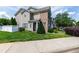 A lovely two-story townhouse boasts manicured landscaping and a welcoming entrance at 818 Bryant St, Raleigh, NC 27603