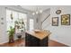 Bright kitchen featuring a wood island with seating, ideal for casual dining and gathering at 818 Bryant St, Raleigh, NC 27603