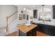 Bright kitchen featuring a wood island with seating, ideal for casual dining and gathering at 818 Bryant St, Raleigh, NC 27603