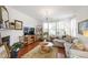 Cozy living room with stylish decor, hardwood floors, and ample natural light creating a welcoming ambiance at 818 Bryant St, Raleigh, NC 27603