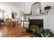 Elegant living room with fireplace and hardwood floors, showcasing the open layout to the dining area at 818 Bryant St, Raleigh, NC 27603