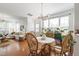 Bright living and dining area with hardwood floors, stylish furniture, and modern lighting fixtures at 818 Bryant St, Raleigh, NC 27603