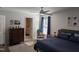 A stylish bedroom featuring blue accents, carpet flooring, and en-suite bathroom access at 908 E Hudson Ave, Durham, NC 27704