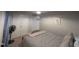 A cozy bedroom with neutral walls, carpet flooring, and a double-door closet for ample storage at 908 E Hudson Ave, Durham, NC 27704