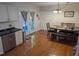 Eat-in kitchen area featuring modern appliances, dining table, and access to the backyard at 908 E Hudson Ave, Durham, NC 27704