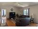 Spacious living room with hardwood floors, large windows, and a cozy seating area at 908 E Hudson Ave, Durham, NC 27704