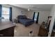 Comfortable main bedroom with carpet, soft lighting, and ample space for relaxation at 908 E Hudson Ave, Durham, NC 27704