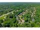Neighborhood aerial view showcasing tree-lined streets and well-spaced homes with lush greenery at 9508 Waterwood Ct, Raleigh, NC 27614