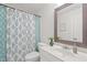 Bathroom featuring a vanity with mirror, patterned shower curtain, and toilet at 9508 Waterwood Ct, Raleigh, NC 27614