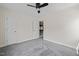 Bedroom features carpeted floor, neutral paint, two windows, and a ceiling fan at 9508 Waterwood Ct, Raleigh, NC 27614