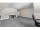 Finished basement or bonus room with gray carpet and a tv at 9508 Waterwood Ct, Raleigh, NC 27614