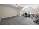 Large bonus room with guitars, natural light, and plenty of flexible space at 9508 Waterwood Ct, Raleigh, NC 27614