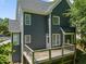 Exterior view showcasing the home's siding, windows, and a wooden deck at 9508 Waterwood Ct, Raleigh, NC 27614