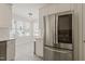 Bright kitchen boasting stainless steel appliances, white cabinets, and a breakfast area for convenient dining at 9508 Waterwood Ct, Raleigh, NC 27614