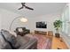 Comfortable living room with hardwood floors, television, and neutral decor, perfect for relaxing at 9508 Waterwood Ct, Raleigh, NC 27614