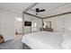 Well-appointed main bedroom features a four-poster bed, plush carpet, and ensuite bath access at 9508 Waterwood Ct, Raleigh, NC 27614