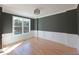 Living room with hardwood floors, crown molding, and lots of natural light at 97 Fox Oak Trl, Pittsboro, NC 27312